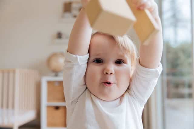 When is the Young Child First Takes Interest in Toys?